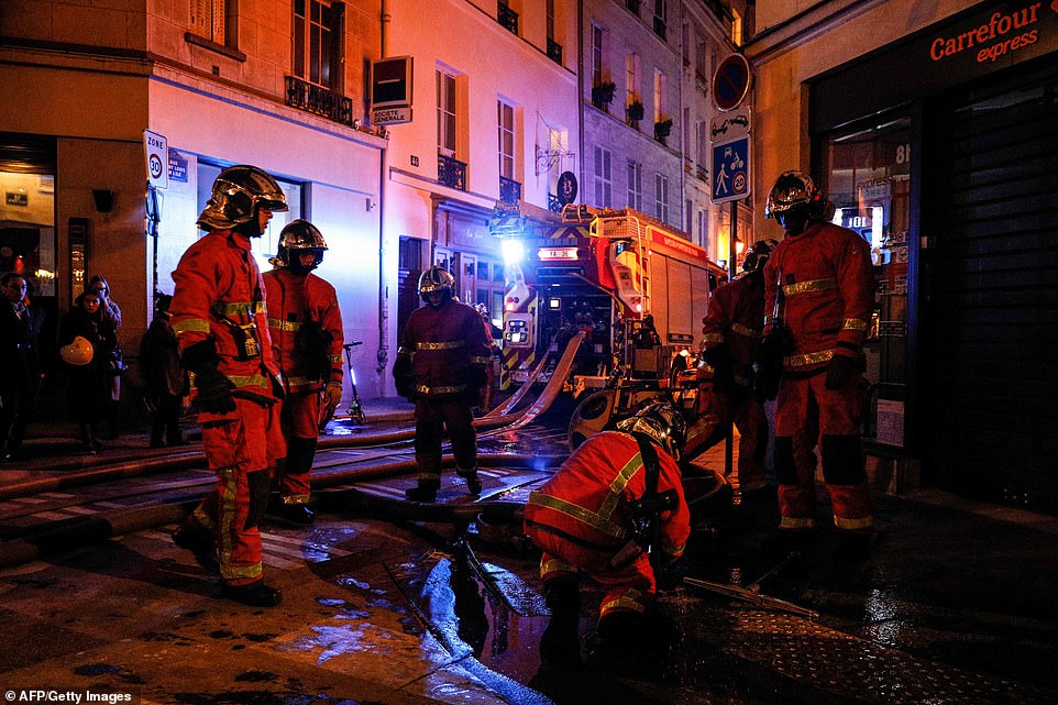 12315812-6925015-French_fire_crews_check_the_hoses_in_the_streets_of_Paris_on_Mon-a-379_1555363752944